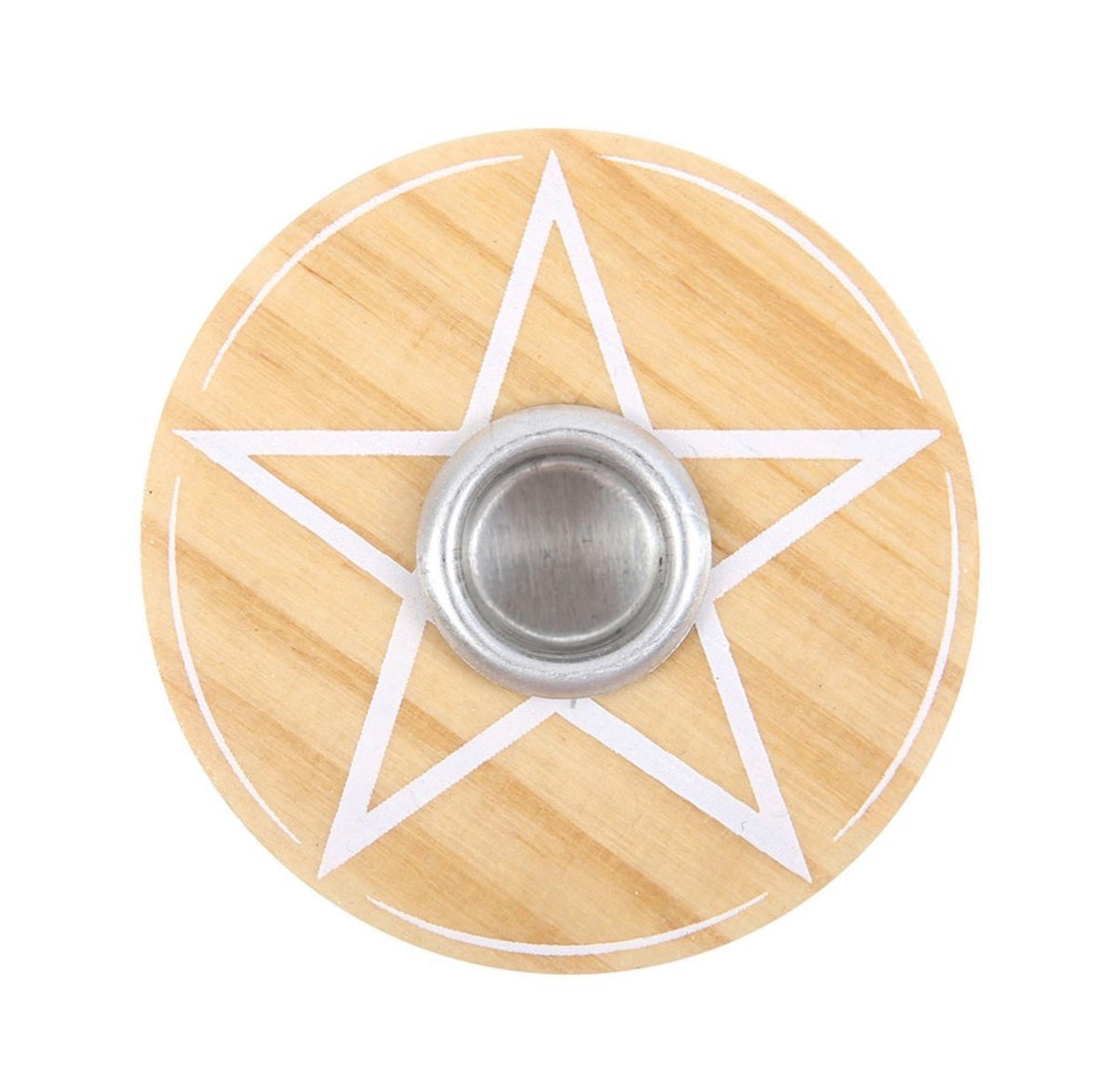 Lit white spell candle in the wooden pentagram holder, styled with dried flowers