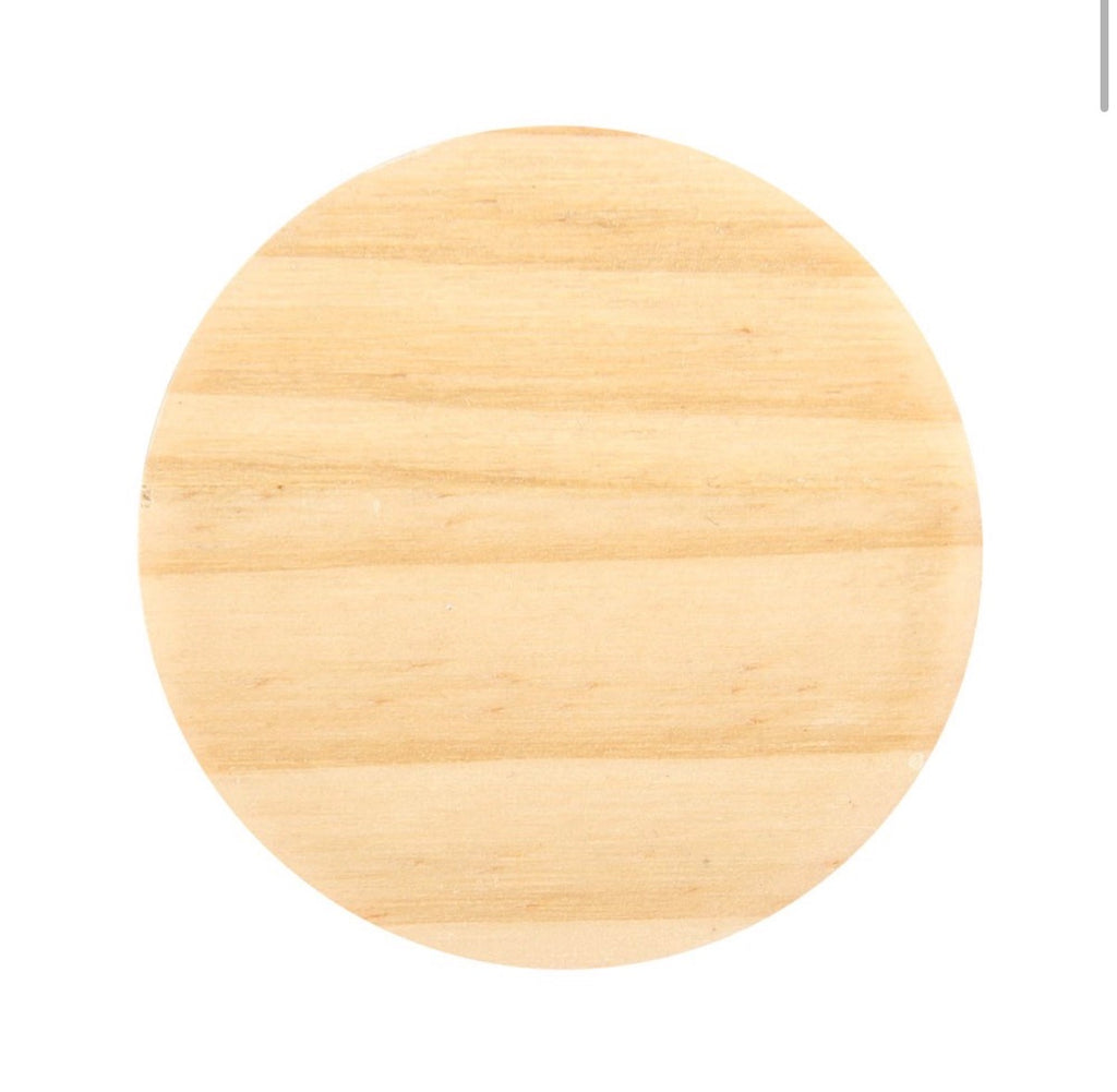 Wooden moon and stars candle holder with a white spell candle in place