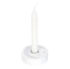 Top-down view of the white candle holder showing the silver crescent moon, stars and metal cup