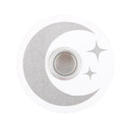 Lit white spell candle in the white and silver moon holder, styled with dried flowers
