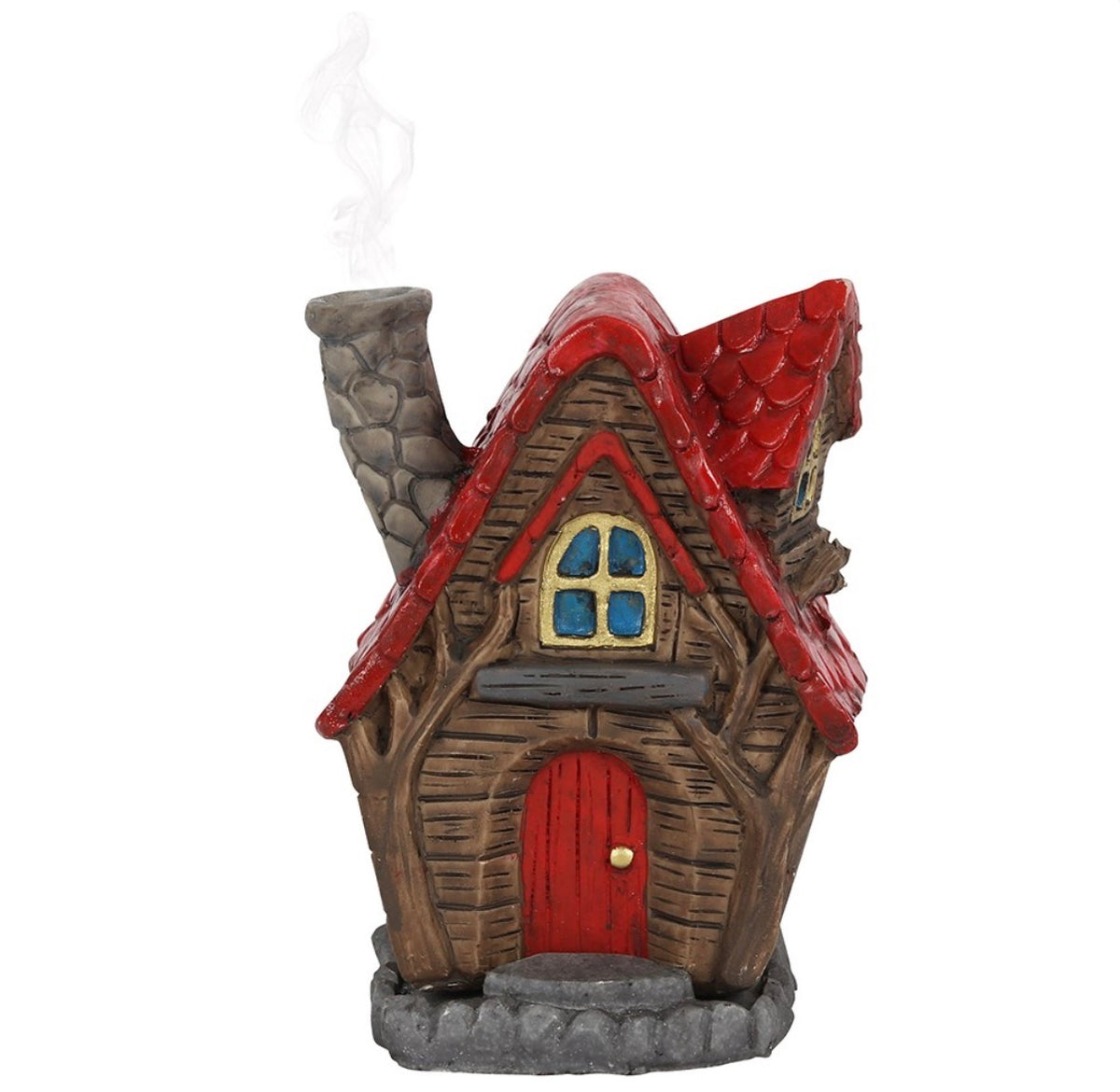 The Willows fairy cottage lifted off its cobbled base with an incense cone in place
