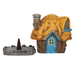 Back view of Buttercup Cottage showing the thatched roof and smoke opening