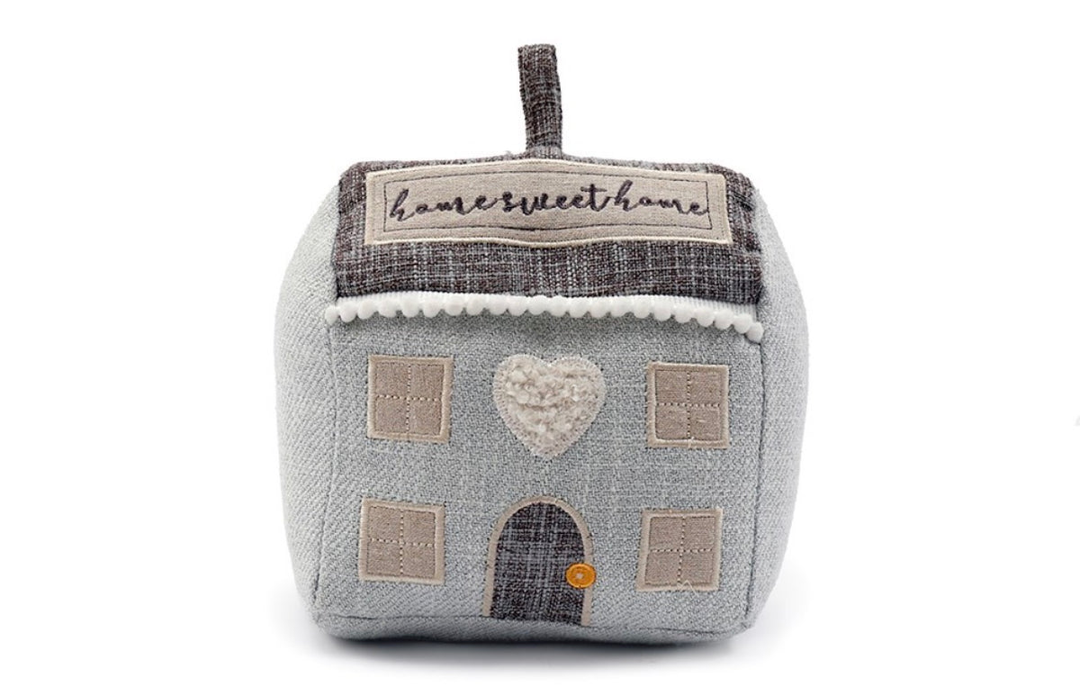 Grey fabric house doorstop with an embroidered home sweet home sign, tweed roof, pom-pom trim and stitched windows