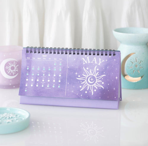 May page of the moon phase calendar showing daily moon phases and a sun illustration