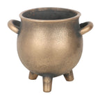 Angled view of the bronze cauldron pot showing its open top and side handle