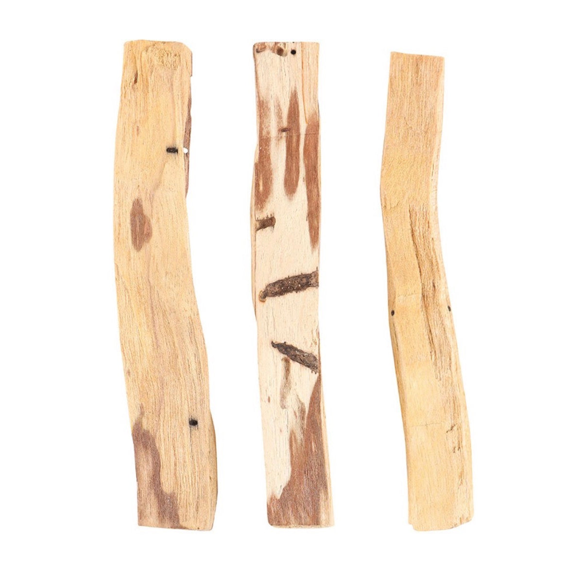 Palo santo box styled on a wooden board with loose sticks and dried flowers