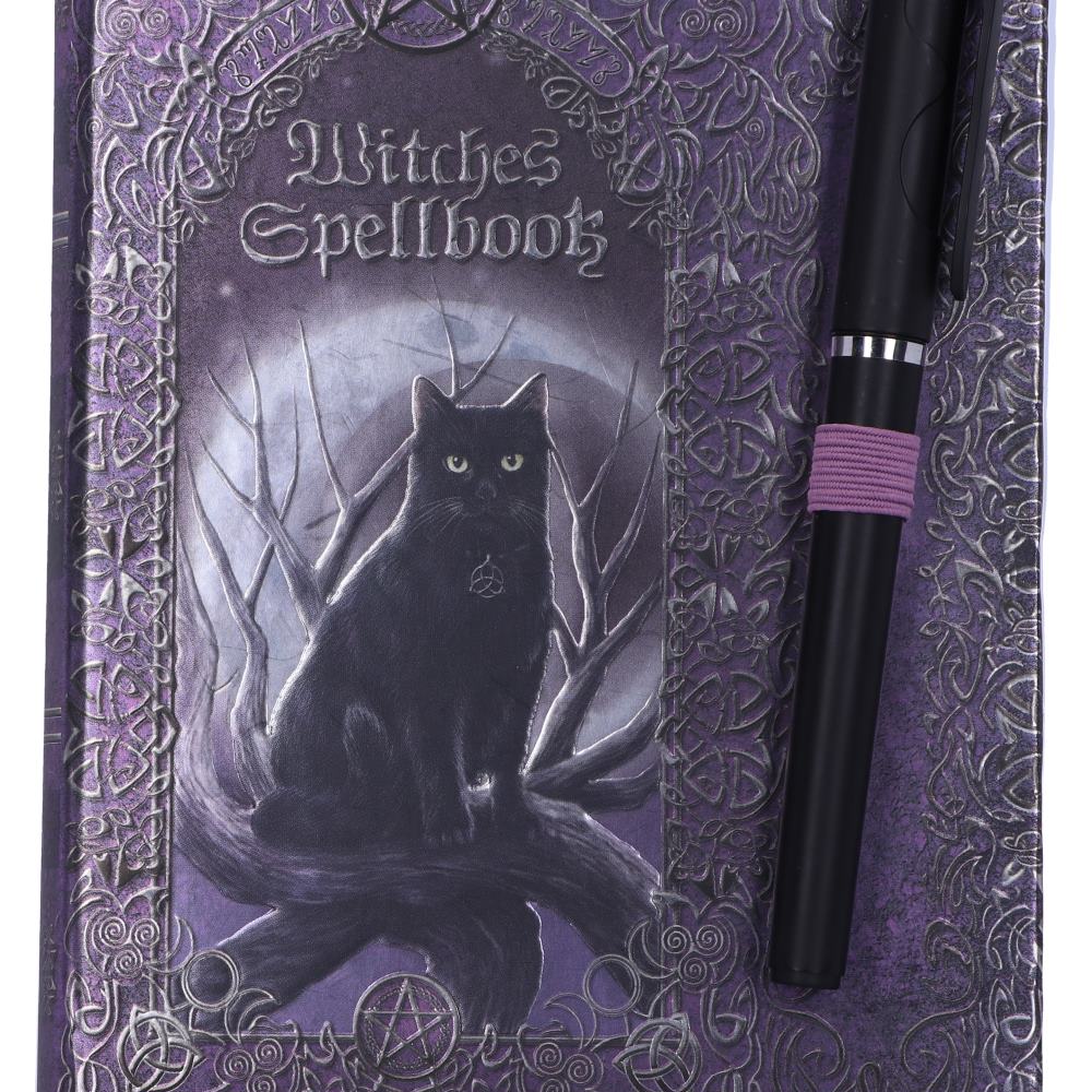 Witches Spellbook journal with pen – lifestyle shot on wooden surface