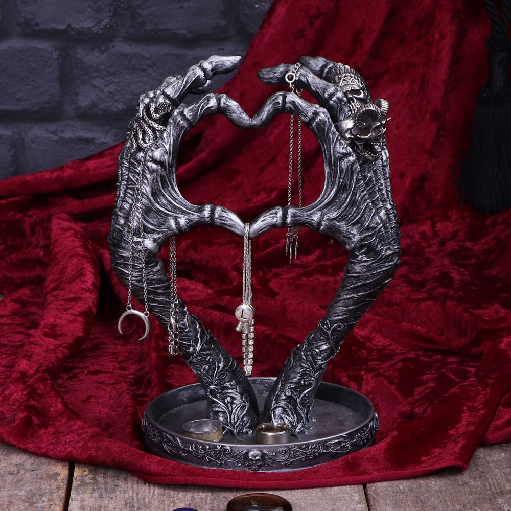 Skeleton hands heart jewellery stand - lifestyle angle view