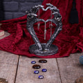 Skeleton hands heart jewellery stand - lifestyle with crystals