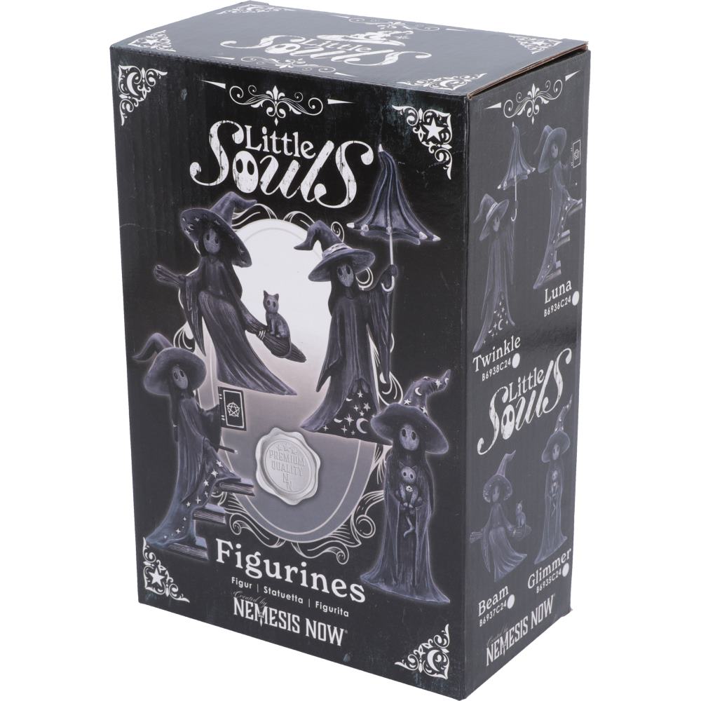 Little Souls Glimmer witch figurine - lifestyle shot in dark library setting