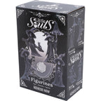 Little Souls Glimmer witch figurine - lifestyle shot in dark library setting