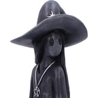Little Souls Sparkle witch figurine - lifestyle shot in dark library
