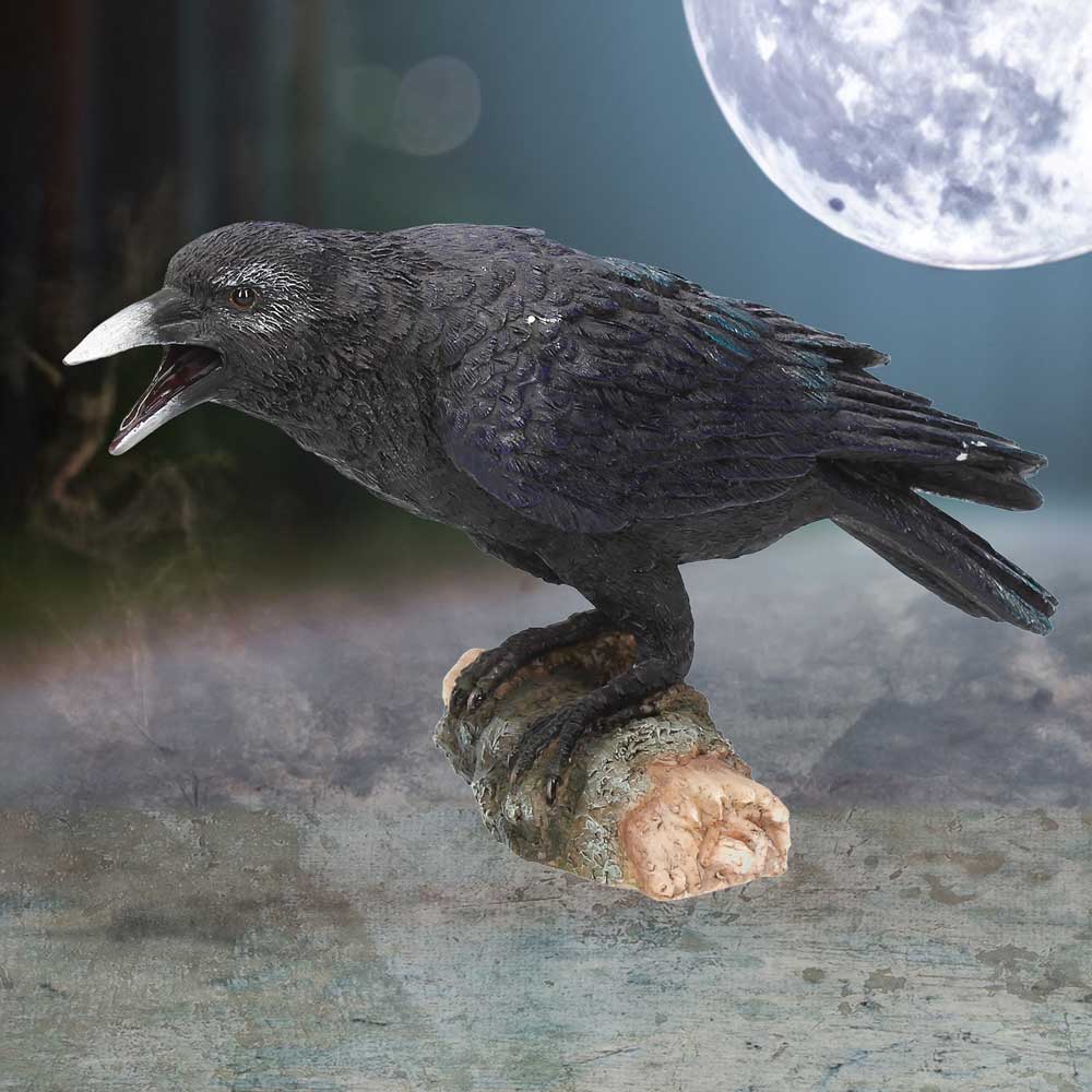 Raven Figurine – lifestyle shot with full moon background