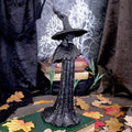 Familiar Forests Witch Figurine - lifestyle shot with autumn leaves