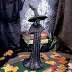 Familiar Forests Witch Figurine - lifestyle shot with autumn leaves
