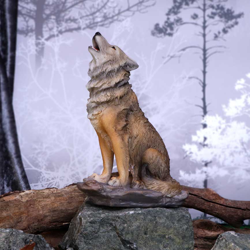 Howling Wolf Figurine - lifestyle shot in misty winter forest setting