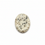 Dalmatian Jasper palm stone on clean white background showing creamy white oval stone with black speckled spots