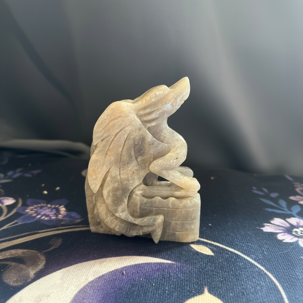 Full side view of the hand-carved moonstone dragon guarding a castle