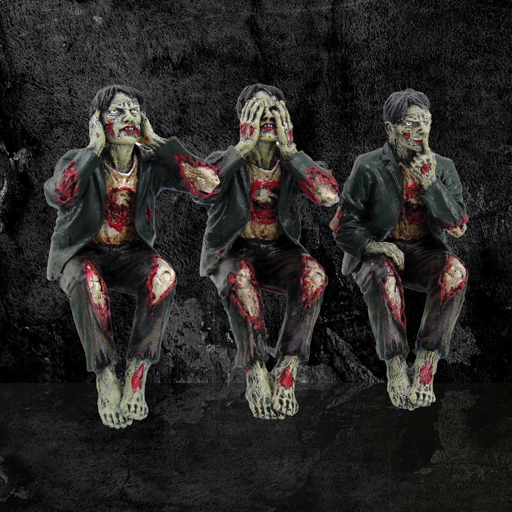 See No Evil Hear No Evil Speak No Evil Zombie Figurines - moody lifestyle shot on dark background