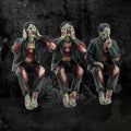 See No Evil Hear No Evil Speak No Evil Zombie Figurines - moody lifestyle shot on dark background