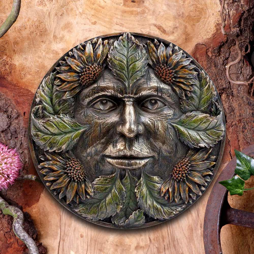 Green Man Wall Plaque - lifestyle shot on wooden surface with natural props
