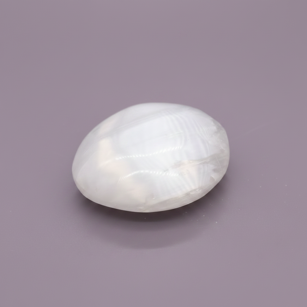 Selenite Palm Stone - surface, purple background