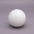 Selenite Sphere - on surface, purple background