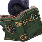 Witchy Black Cat Spell Book Figurine - lifestyle shot nestled among open books