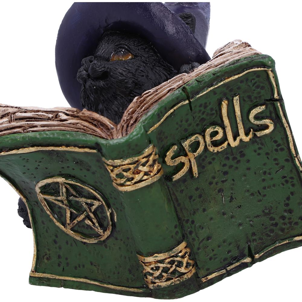 Witchy Black Cat Spell Book Figurine - lifestyle shot nestled among open books