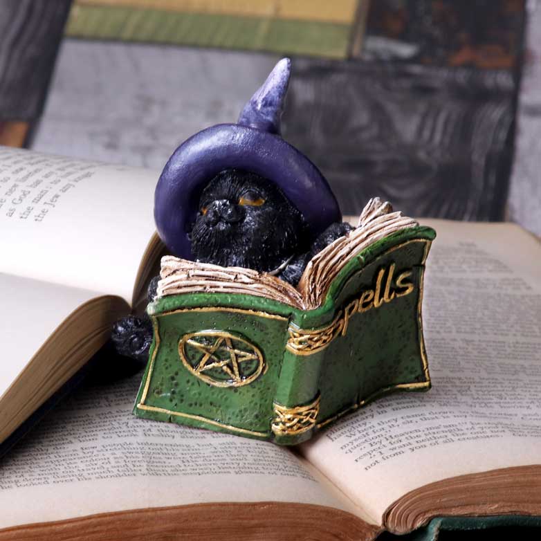 Witchy Black Cat Spell Book Figurine - lifestyle shot rear view on open book pages