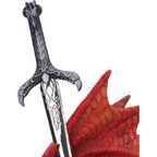 Close-up of ornate pewter sword hilt with engraved blade
