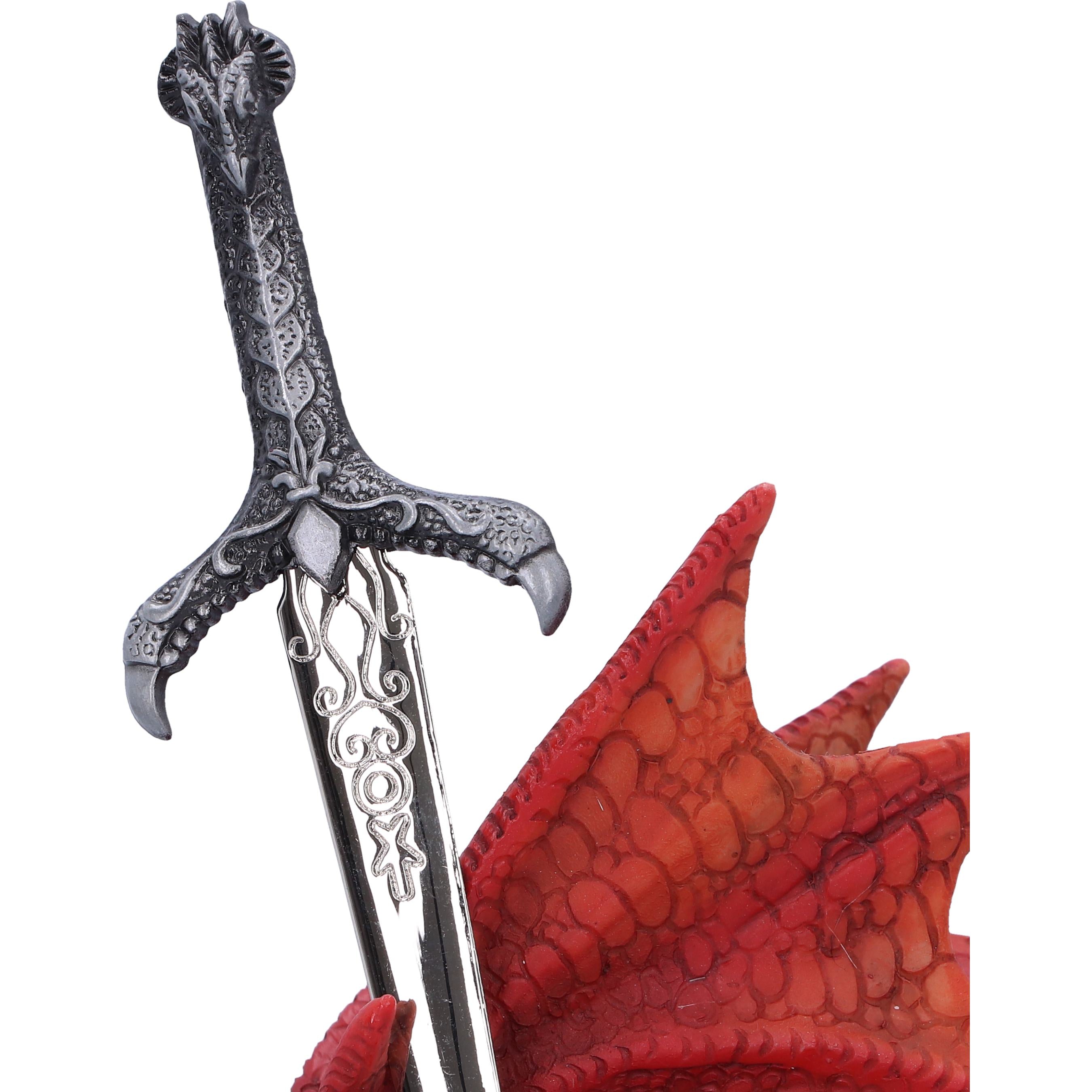 Close-up of ornate pewter sword hilt with engraved blade
