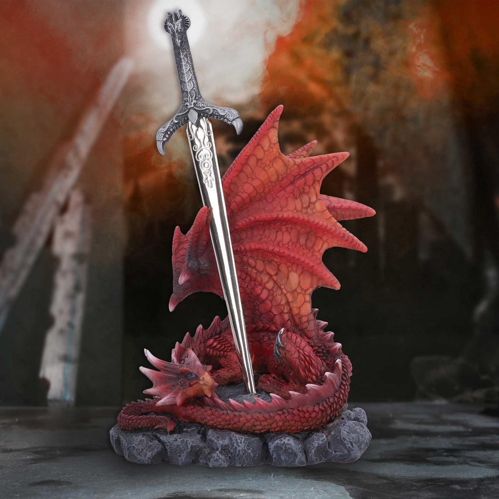 Red dragon sword figurine styled in dramatic fantasy setting
