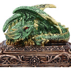 Green dragon trinket box open showing black velvet-lined interior
